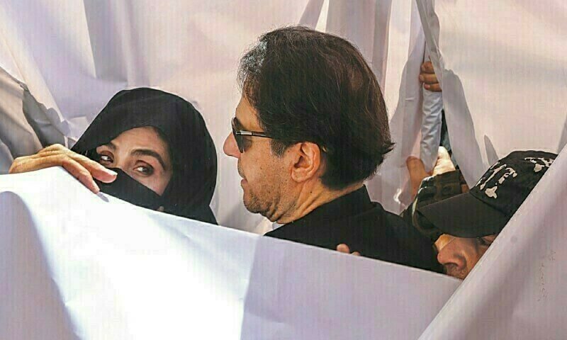 a man and woman in black