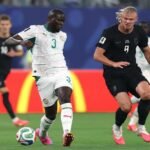 Erling Haaland celebrating goal during Norway vs Senegal World Cup match in New Jersey stadium