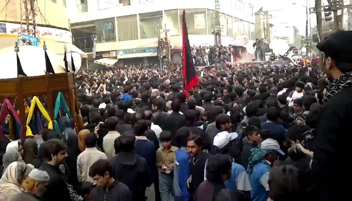 Police and officials overseeing Muharram processions in Lahore with active monitoring and crowd control systems in place.