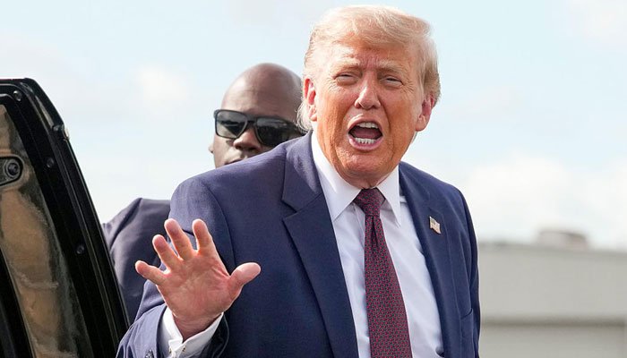 US President Donald Trump speaking to reporters amid ongoing discussions involving Iran and maritime security in the Strait of Hormuz.