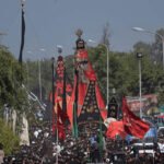 Participants attending the central 9th Muharram gathering at Nishtar Park in Karachi under strict security arrangements.