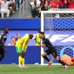 Stephen Eustaquio celebrates after scoring Canada's late winner against South Africa.