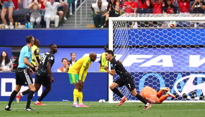 Stephen Eustaquio celebrates after scoring Canada's late winner against South Africa.