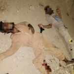 Police officers at the scene of an encounter in New Karachi where two suspects were arrested