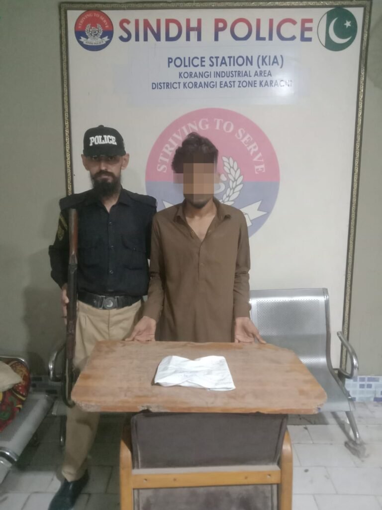 A suspected street criminal arrested by Korangi Police with a recovered TT pistol.