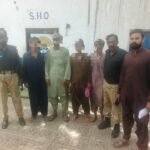 Malir Police officers transfer detained Afghan nationals to a holding center in Karachi