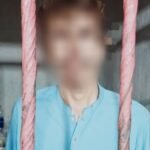 Karachi police officers detaining suspects during a crime crackdown in East Zone Baldia Colony