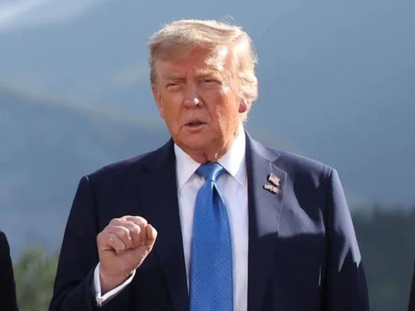US and Iranian delegations engaged in negotiations in Switzerland while Donald Trump issues warning statement