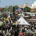 Mourners taking part in a Yom Ashura procession under strict security in Pakistan