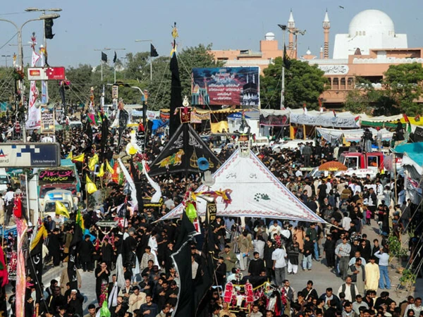 Mourners taking part in a Yom Ashura procession under strict security in Pakistan