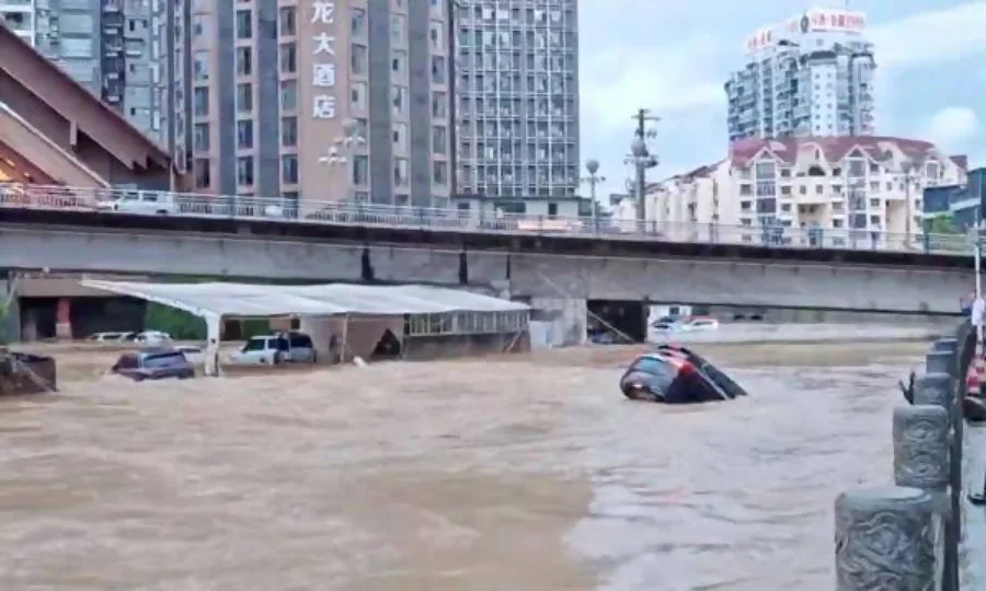 Rescue teams evacuate residents from flooded neighborhoods in southern China after heavy rainfall.