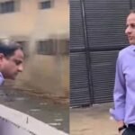 Enforcement officials inspect a Karachi drain during an anti-dumping operation.