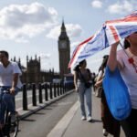 People seek shade during an intense heatwave as the UK records one of its hottest Junes on record.