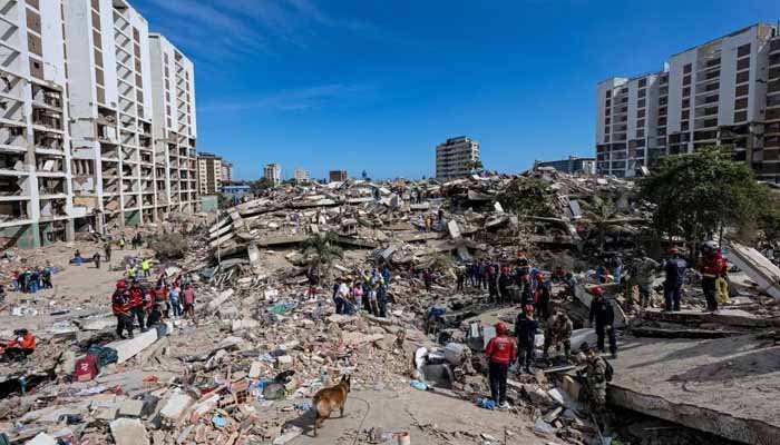 Rescue teams search through earthquake-damaged buildings in Venezuela as the country observes national mourning.