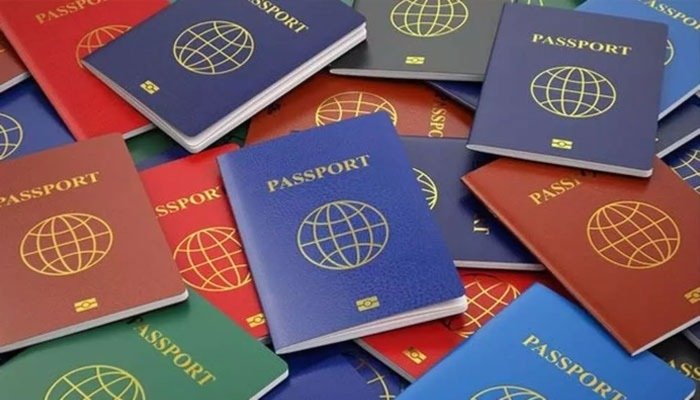 A Pakistani passport displayed alongside international travel documents representing the 2026 Henley Passport Index rankings.