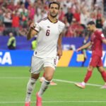 Spain players celebrate after defeating Portugal in the FIFA World Cup Round of 16 while Cristiano Ronaldo reacts after the match.