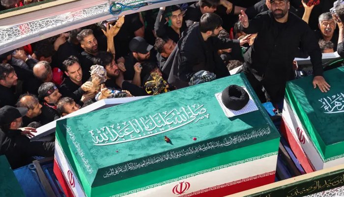 Crowds gather in Mashhad as Ayatollah Ali Khamenei is laid to rest at the Imam Reza shrine complex.