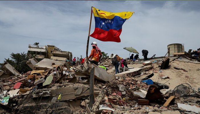 Damaged buildings and rescue workers in Venezuela following the powerful earthquakes that caused widespread destruction and casualties.