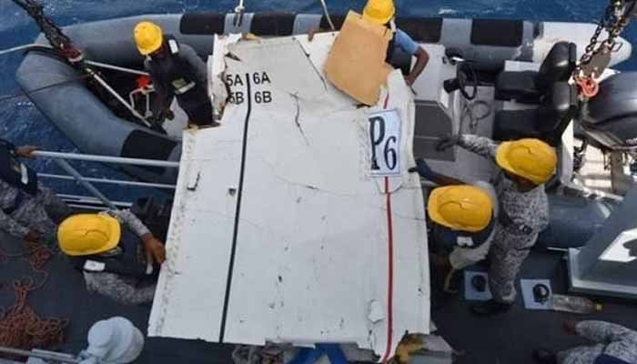 Investigators inspecting debris from the cargo plane that crashed off the Balochistan coast.