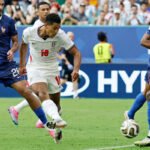 England players celebrate after defeating France 6-4 in the FIFA World Cup third-place match, with Bukayo Saka scoring a hat-trick.