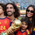 Spain footballer Marc Cucurella, known for his long curly hair, during a FIFA World Cup celebration.