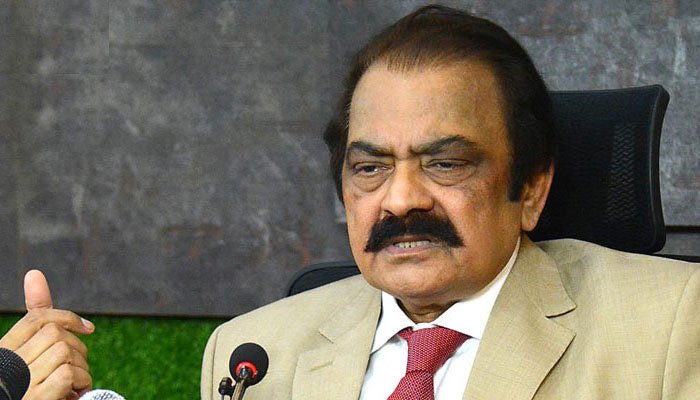 Prime Minister's Adviser Rana Sanaullah speaks during a television interview while responding to political questions.
