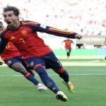 Spain players celebrate with the FIFA World Cup trophy after beating Argentina 1-0 in the 2026 World Cup final.