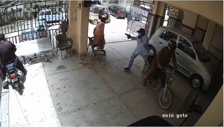 Armed robbers seen in CCTV footage during a daylight robbery outside Zainab Arcade in Sharafabad, Karachi.