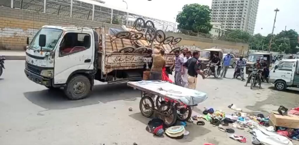 Heavy machinery removes illegal encroachments during an operation in Saddar Town, Karachi.