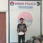 Landhi Police display seized gutka and mawa after arresting a suspect in Karachi.