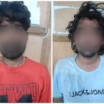 Karachi police display seized hashish after arresting two suspected drug dealers in Saeedabad.