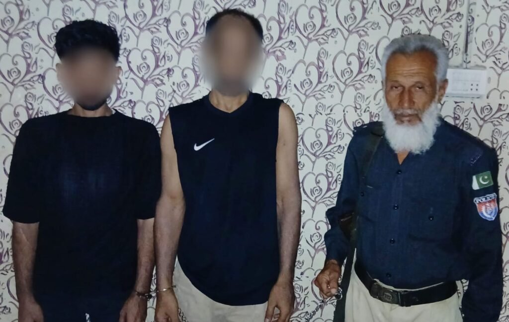 District East Police officials display recovered crystal narcotics after arresting two suspected drug dealers in Karachi's Soldier Bazaar.