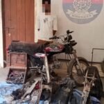 Recovered stolen motorcycle and spare parts seized by Landhi Police in Karachi.