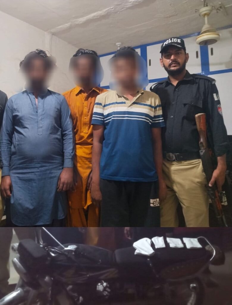 Karachi police display arrested robbery suspects and recovered motorcycle after an operation in Steel Town.