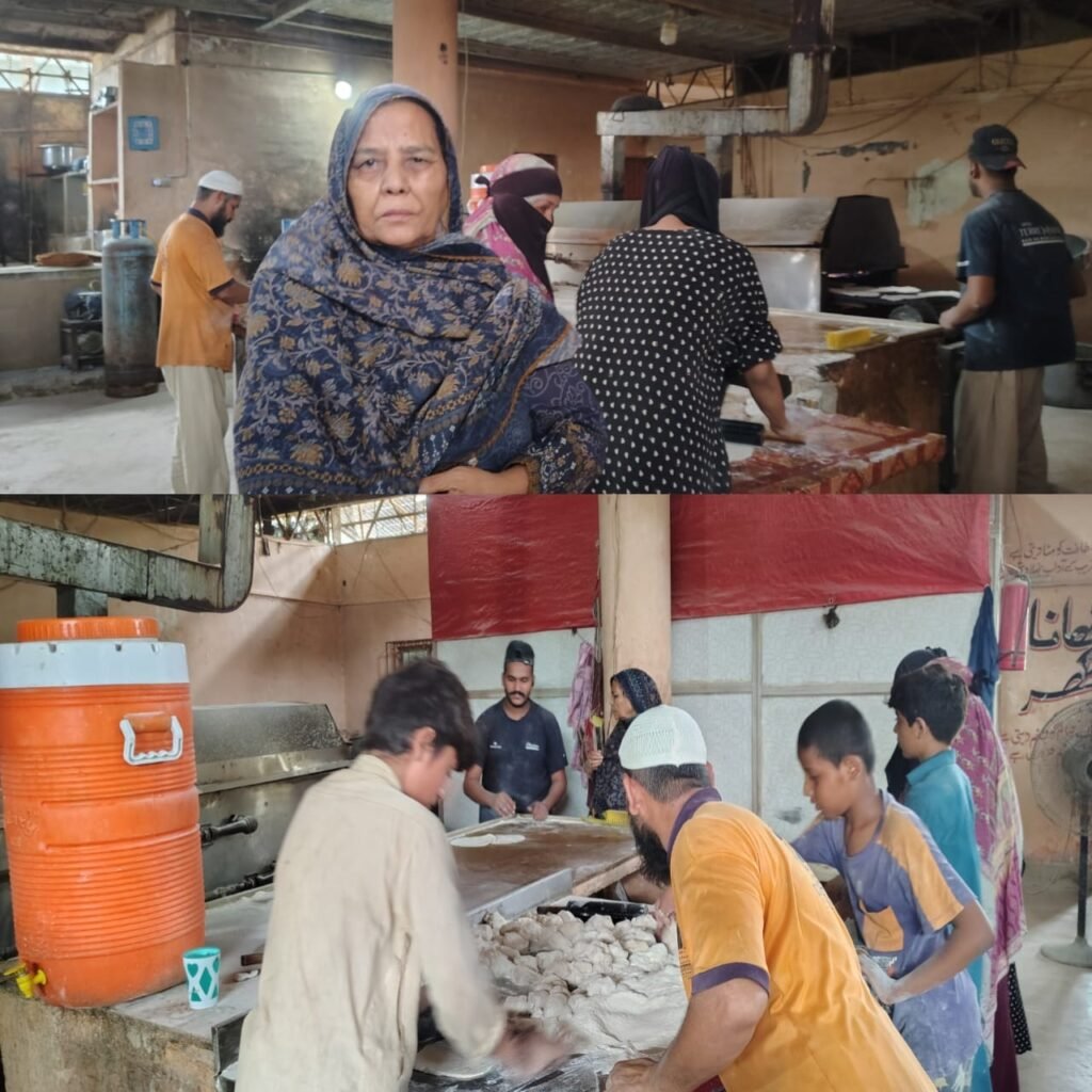 Workers operating bread-making machines at Khana Ghar to provide free bread to needy people in Karachi