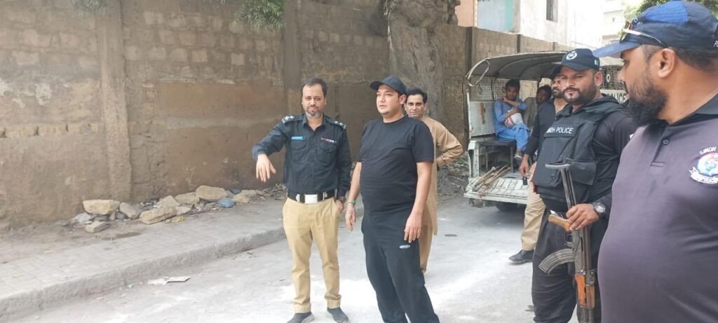 Assistant Commissioner Hazim Bhangwar supervising the demolition of illegal shops on Burns Road in Karachi.