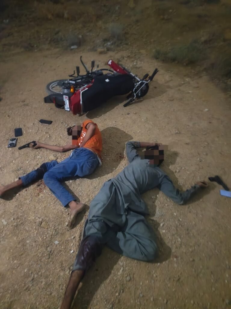 Karachi police officers with two suspects arrested after a reported encounter in connection with a viral robbery case.