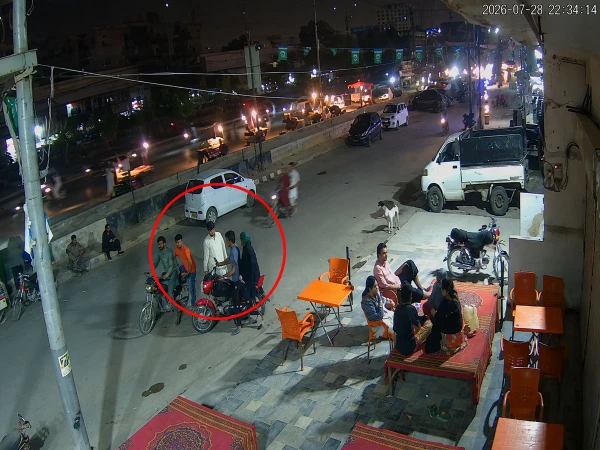 CCTV footage showing armed suspects snatching a motorcycle from a couple in North Karachi.