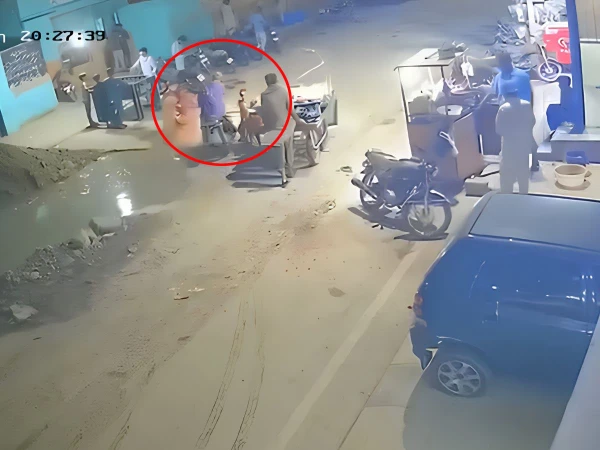 Residents rescue a child from a water-filled pit near Manzoor Colony pumping station in Karachi after the incident was captured on CCTV.