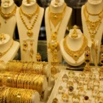 Gold bars and market charts showing rising gold prices in Pakistan
