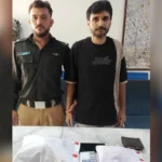 East District Police officials with seized narcotics after arresting a suspected drug trafficker in Karachi's Jamshed Quarters.