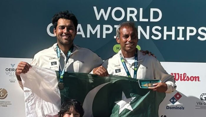 Pakistani tennis player Aisam-ul-Haq with the ITF Masters World Championship mixed doubles title