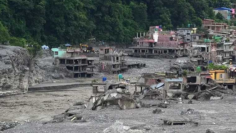 Rescue workers search for missing people at a hydropower project after severe flooding in Nepal