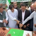 SBCA Additional Director General Shakeel Siddiqui hoists the Pakistani flag during Independence Day ceremony