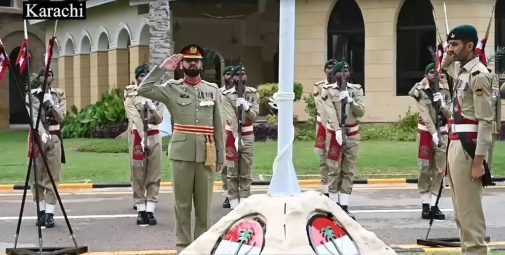 tan Army officers and soldiers attend Independence Day flag-hoisting ceremony in Pakistan