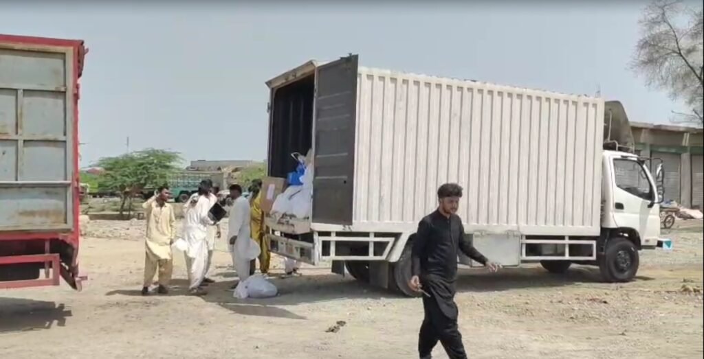 Customs officials inspect non-custom-paid iPhones, laptops and smartwatches in Jacobabad