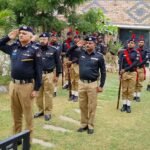 DIG East Dr. Farukh Ali lays flowers at the martyrs' memorial during the Sindh Police Martyrs Day ceremony in Karachi.