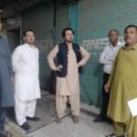 Officials inspect and seal shops at Bilal Center and Koh Noor Center in Karachi for fire safety violations.
