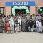 Motorway Police South Zone DIG Javed Akbar Riaz hoists the Pakistani flag in Karachi