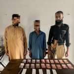 Mominabad Police officers arrest two suspects in a gambling case in Karachi